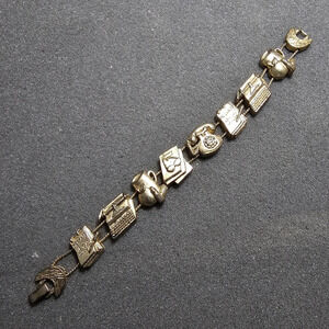 Vintage Tofa Gold Tone Slide Charm Bracelet 7.5 Inches Long shows signs of wear